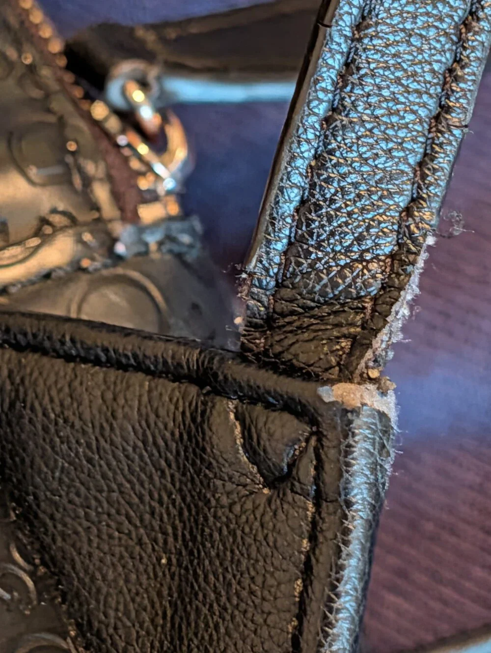 GUESS Black Embossed Logo Mini Backpack with Gold Accent